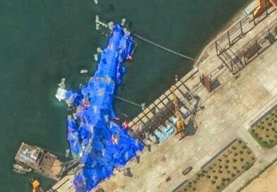 North Korea pulls capsized warship upright after botched launch, report says