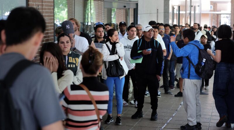 As undocumented migrants line up for Spain’s amnesty program, political opponents vow a fight