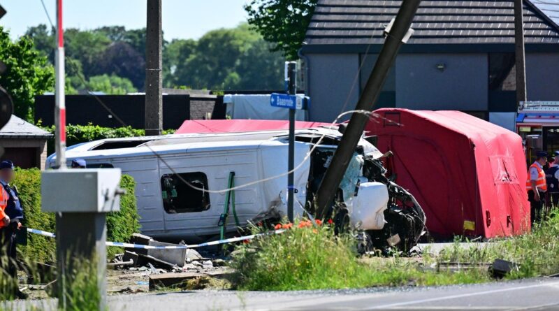 Train crashes into school minibus in Belgium, with unconfirmed reports of fatalities