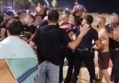 Violent brawl erupts as beachgoers slug it out with deckchairs and wooden crates