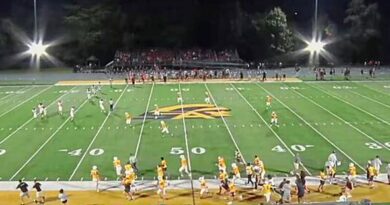American football match ends suddenly as gunshots heard and players and cheerleaders flee