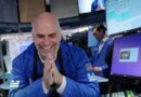 Dow soars 1,000 points on strong corporate earnings and hopes of Iran deal