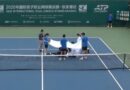 Tennis star collapses twice on court and covered with towels in scary incident