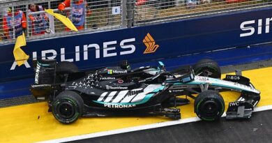 Singapore GP Sprint race result: George Russell crashes from lead as two McLaren's collide