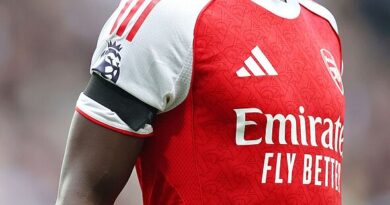 Why are Arsenal wearing black armbands against Lille tonight?